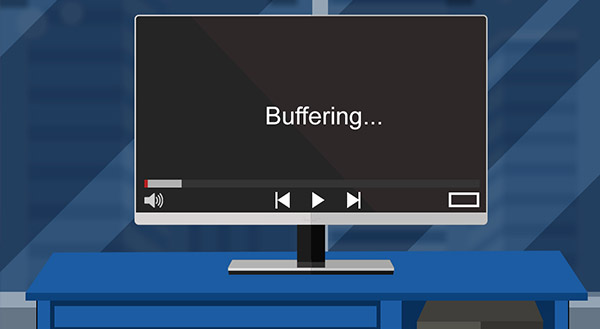 A monitor on a desk showing a buffering video screen, illustrating slow internet speeds and lag.