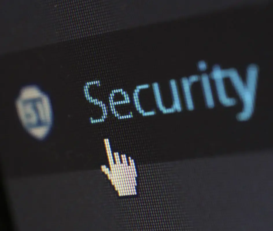 A close-up of a computer screen displaying a digital security shield and cursor, representing malware removal services by New Ross PC Repairs.
